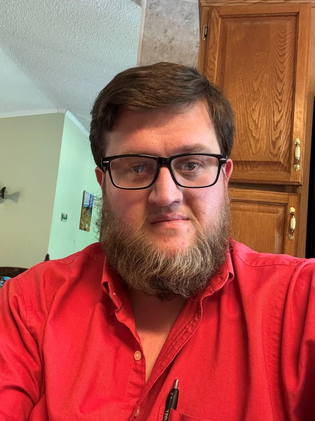 Joseph Cleveland wearing a red shirt.