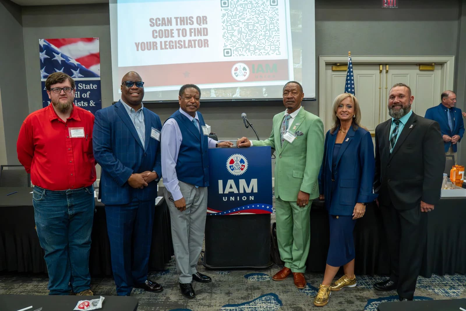 Joseph Cleveland standing with members and leaders at an IAM union event.